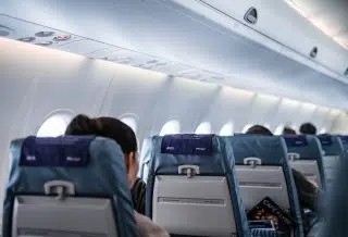 people sitting on gray and white airplane seats